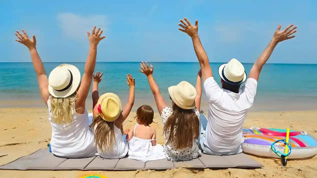 Image of family sitting by the beach